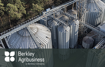 Berkley Agribusiness Arial view of agribusiness manufacturing plant with silos for processing and storing agricultural products, flour, cereals and grain