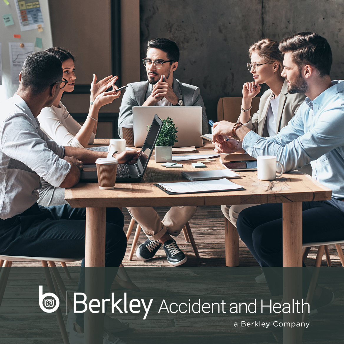 Berkley Accident and Health Young business team sitting around conference table in a discussion