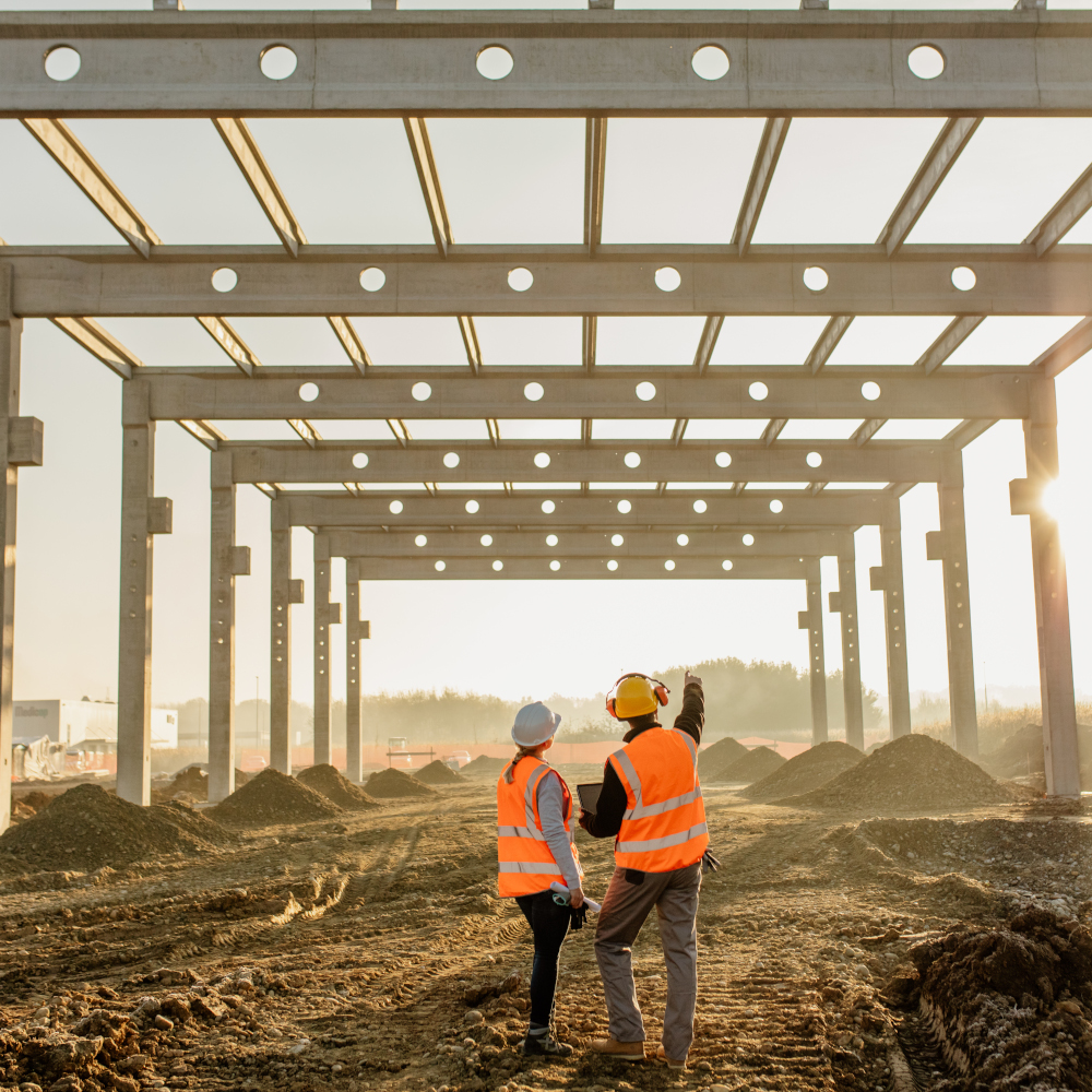 Two construction look at construction in progress